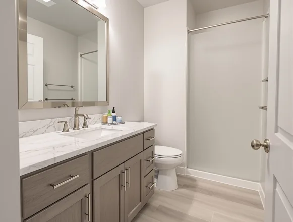 Bath Refresh + Smart Home — UTS BuildPros unit turn renovation Unit turn bathroom renovation — updated vanity, quartz top, modern fixtures, Plano apartment community